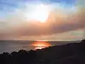 Smoke from the Corral Fire drifts out over the Pacific Ocean on November 24.