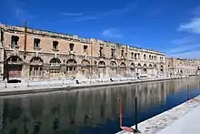 Factory building (1863) alongside No. 1 & 2 dock (Galley Storehouse and Sheer Bastion lie beyond).