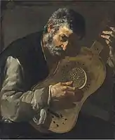 A man playing a guitar