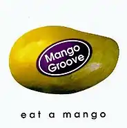 A purple sticker on a mango reads 'Mango Groove'. The mango is matted to a white background. Below the mango is the album title, rendered in lowercase sans-serif type.