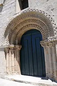 Church of Manhente portal and its intricate carvings.