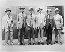 Six formally-dressed men