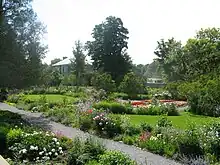 View of the gardens of Maplelawn, with the house visible in the distance