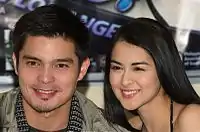 A close angle head shot of Dantes and Rivera smiling