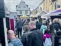 Crowds amongst stalls at Market Place in St Albans Market