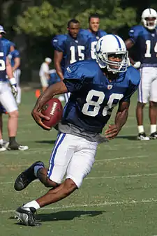 Marvin Harrison running with the football during practice