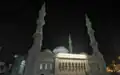 Side view of the Mary, The Mother of Jesus Mosque (formerly named Sheikh Mohammed bin Zayed Mosque) at night.