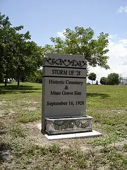 A memorial store reading "Storm of '28 Historical Cemetery & Mass Grave Site. September 16, 1928"