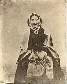 Sepia-coloured image of Matooskie wearing a shawl, date unknown.