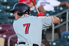 A baseball player in gray