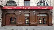 Ground floor wooden Art Deco façade, with the inscription "Maxim's'