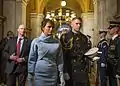 Melania Trump is escorted by a White House social aide at the United States Capitol in 2017