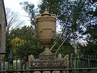 Monument with railings to Warren Hastings in the churchyard of the Church of St Peter c. 1 metre east of east end of chancel