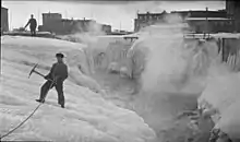 B&W picture of men standing on ice