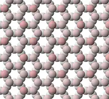 View of tetrahedral sheet structure of talc. The apical oxygen ions are tinted pink.