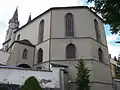 Rear of St. Michael's with a cannon ball in the top right of window arch