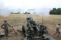 Michigan ANG soldiers fire a 155 mm M777 Howitzer, at the Camp Grayling Joint Maneuver Training Center during Exercise Northern Strike 2016