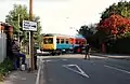 Railcar using the Moor Road crossing. Moor Road station is located on the left.