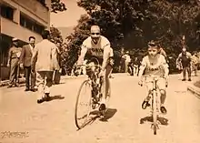 A man and a child on a bike.