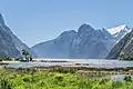 View from head of Milford Sound of some of the Darrant Mountains on the north side of sound being The Lion and beyond it Rover Peak 1,524 m (5,000 ft) and snow covered Mount Pembroke 2,015 m (6,611 ft).