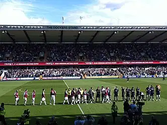 West Ham and Millwall players shake hands before kick-off at The Den on 17 September 2011.