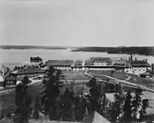 Black and white aerial view of the lodge and the surrounding resort and golf course