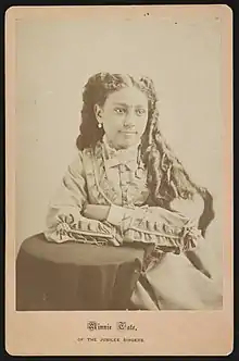 A 19c. photograph of Minnie Tate, a young African-American singer.