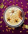 Kheer topped with dried fruits and nuts