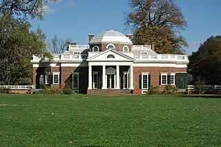 A neoclassical building in red brick and white stone