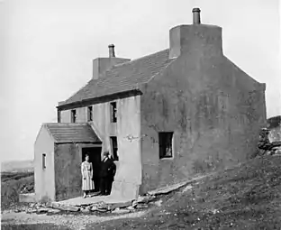 Mr. James Irving and daughter Voirrey at their house