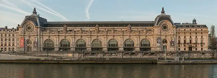 Beaux Arts Doric pilasters on the facade of the Gare d'Orsay, Paris, designed by Victor Laloux in c.1896-1897, and built in 1898-1900