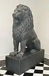 One of a pair of antique statuary lions at the entrance to the exhibits.