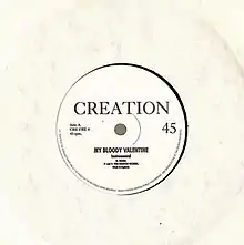 A black 7-inch record in a plain white sleeve. Centred black text reads "Creation My Bloody Valentine Instrumental".