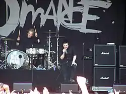 My Chemical Romance, dressed in black, onstage