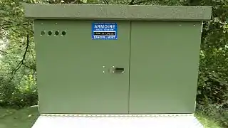 Electrical substation with the words "High voltage cabinet - Pont de l'Oulle - Risk of death".