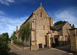 Naish Priory, including attached priory cottage and north boundary railings