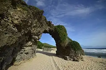 Nakabuang Arch in Morong Beach