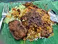 Nasi kandar with fried fish and vegetables