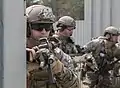 Soldiers from the 20th Special Forces Group, Massachusetts National Guard prepare to raid an objective during training here, June 8, 2018. The highly trained and specialized soldiers are taking part in a combined arms exercise that tests the capabilities of combat support units.