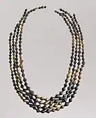 Necklace beads; 2600–2500 BC; gold and lapis lazuli; length: 54 cm; Metropolitan Museum of Art