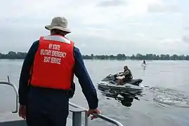 A New York Naval Militia officer works alongside a United States Border Patrol agent.