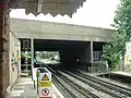 The A12 Eastern Avenue crosses the Central line just to the south of Newbury Park, with the eastbound tunnel portal to the right of the remains of the old route to Ilford.