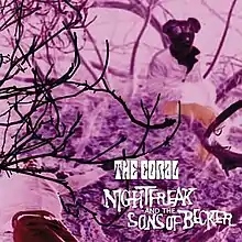 The album art for Nightfreak and the Sons of Becker, depicting two figures sitting on a patch of grass, partially obstructed by branches of a tree