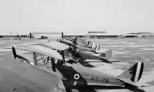 Row of single-engined military biplanes