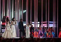 Male singer with female singers and dancers