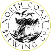 A whale diving through a ring emblazoned with the words North Coast Brewing Company