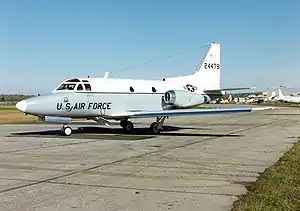 A white-and blue twin-engined training jet