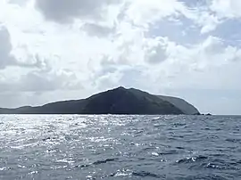 Murimotu Island (foreground) with the Lighthouse just visible on top, Otou just behind the light to the right and Surville Cliffs extending out to the right in the background