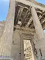 North Portico of the Erechtheion, where a coffer is missing, signifying the supposed place where Zeus struck his lightning bolt, killing Erechtheus. Another belief is that this was the location where Poseidon struck his trident into the Acropolis.