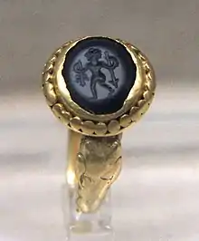 Gem-inlaid gold ring of Central Asian design, tomb of Xu Xianxiu, 571 AD.